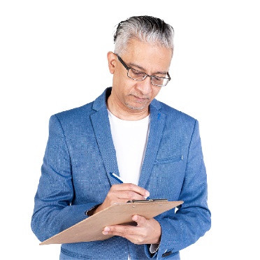 A person writing on a document.