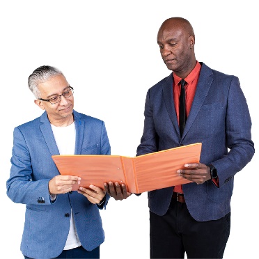 2 people looking at a document together.