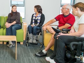 People taking part in a community meeting.