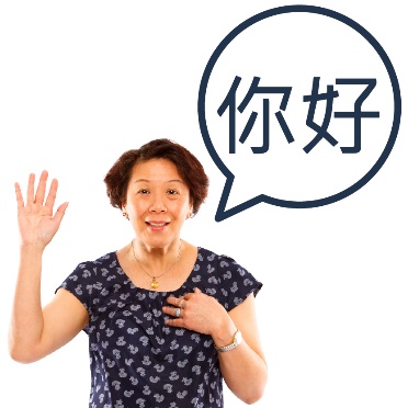 A person with their hand raised. Next to them is a speech bubble with a language other than English in it.